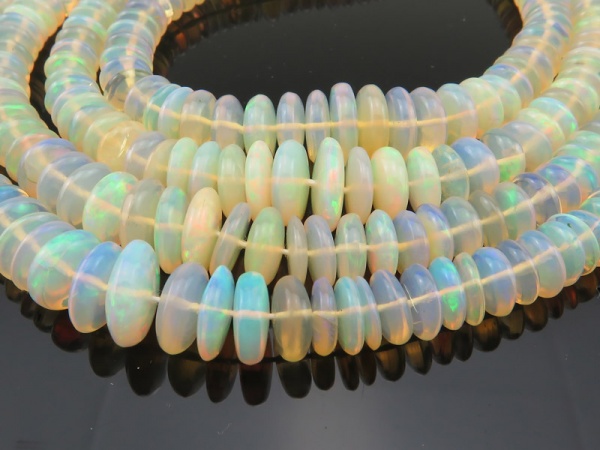 AA Ethiopian Opal Smooth Disc Beads 4-9mm ~ 16'' Strand